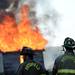 Firefighters watch as a small structure is engulfed in flames during a training exercise and controlled burn in 6700 block of Warner Rd. in Pittsfield Township on Thursday, May 9, 2013. Melanie Maxwell I AnnArbor.com